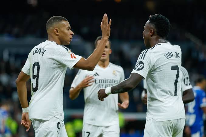 Mbappe and Vini in celebration. Real Madrid vs Manchester City UCL Play-offs