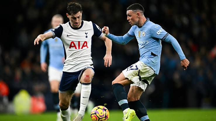 Tottenham Hotspur defender, Ben Davies tackling Manchester City forward, Phil Foden in the 2024/25 Premier League first leg. Photo Credit- NBC sports