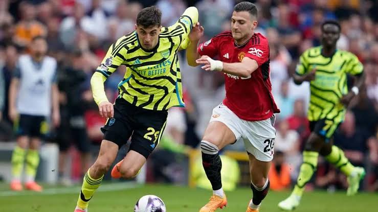 Arsenal forward, Kai Harvertz been tackled by Manchester United defender, Diogo Dalot in last season Premier League clash. Photo Credit- Football 365