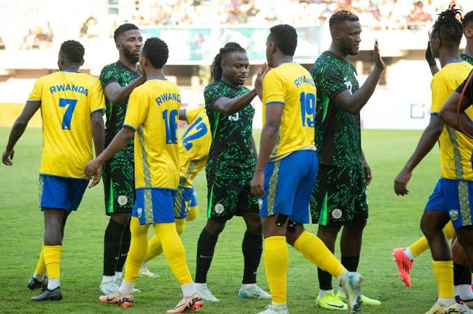 The Nigerian Super Eagles and the Rwandan Amavubis exchange greetings before match begins. Photo Credit- Vanguard