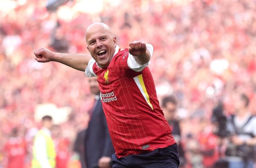 Liverpool's manager, Arne Slot in celebration after winning the 2024/25 Premier League trophy