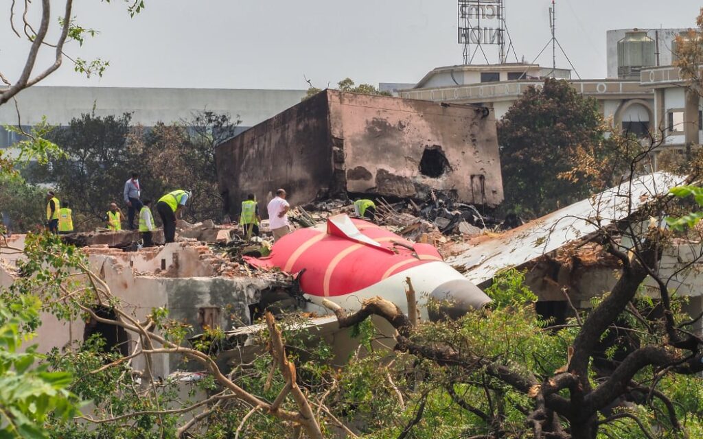 An investigation team inspects the wreckage of Air India flight 171 a day after it crashed.
