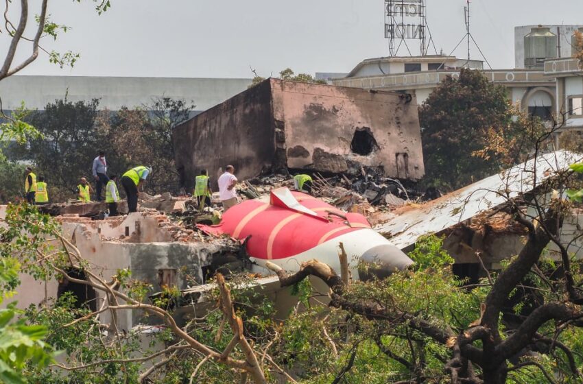 An investigation team inspects the wreckage of Air India flight 171 a day after it crashed.