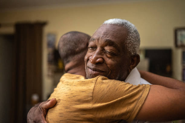Son hugging the father. Photo Credit- IStock