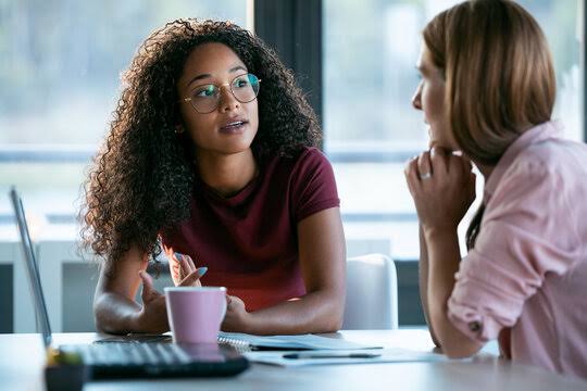 Photo of people having a conversation. Photo Credit- Adobe stock