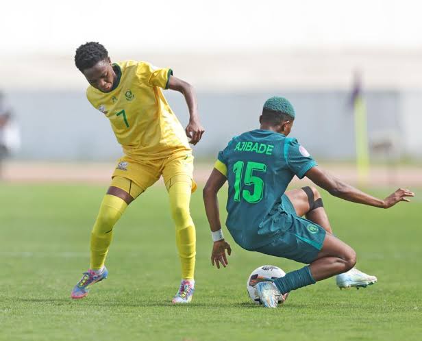 Super Falcons captain, Rasheedat Ajibade with a tackle against Bayana Bayana. Photo Credit- Super Sports