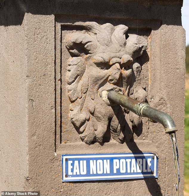 A tap at a village fountain in Auvergne with a sign indicating the water is not drinkable