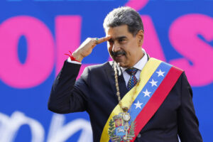 Venezuelan President, Nicolás Maduro salutes.