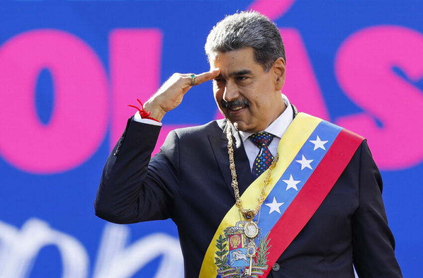 Venezuelan President, Nicolás Maduro salutes.