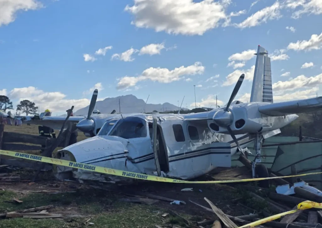 Emergency teams at the scene of a light aircraft crash near Thembalethu, George. Two passengers escape with minor injuries.