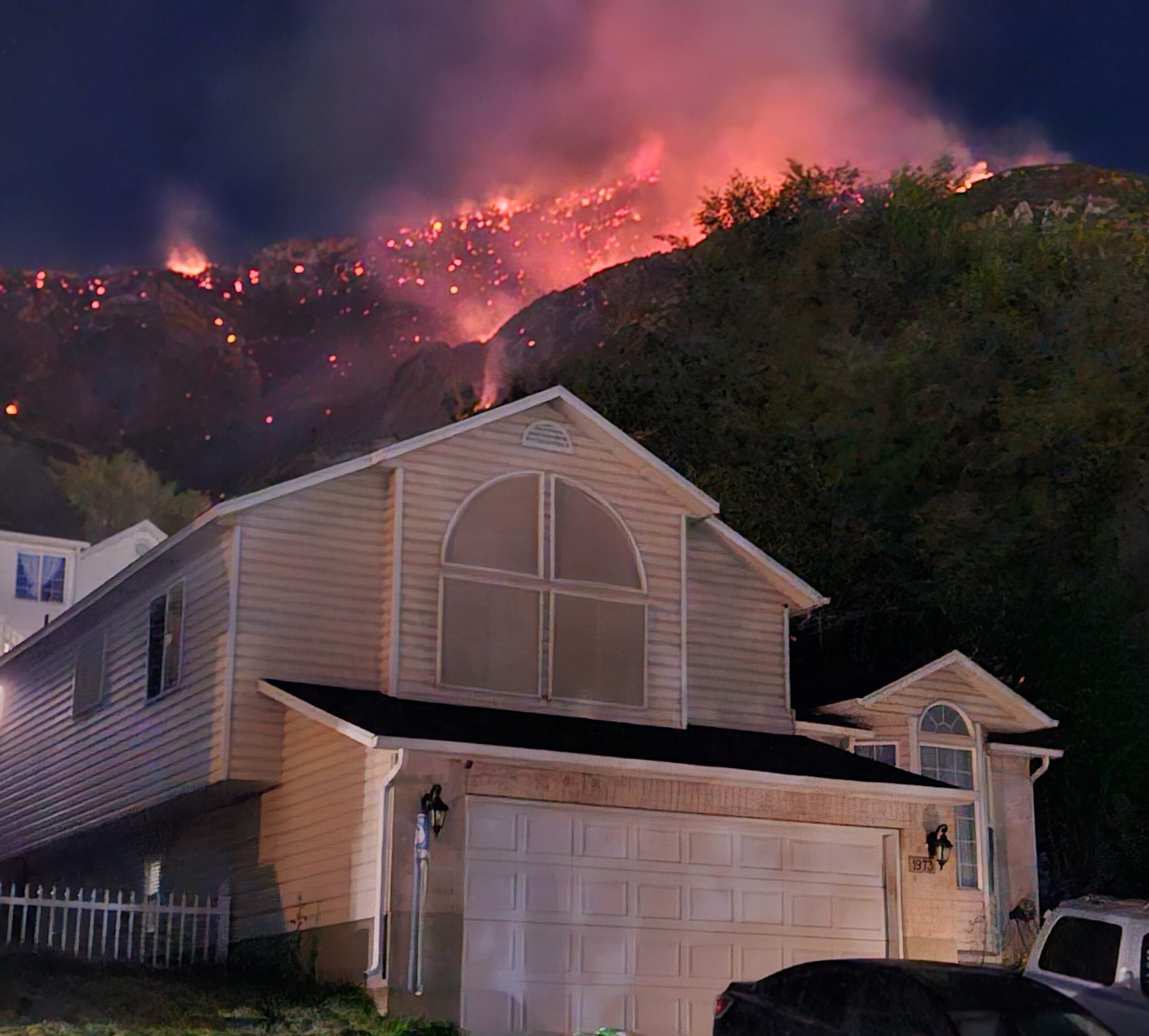 Aerial crews battle the Buckley Draw Fire as smoke billows over Utah Valley Sunday evening.