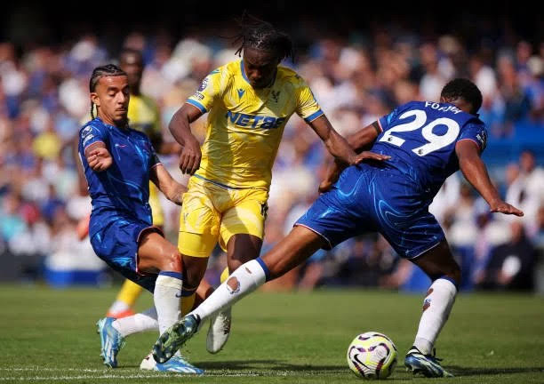 Crystal Palace forward, Eberechi Eze been tackled by Chelsea's defenders. Photo Credit- EmperorA