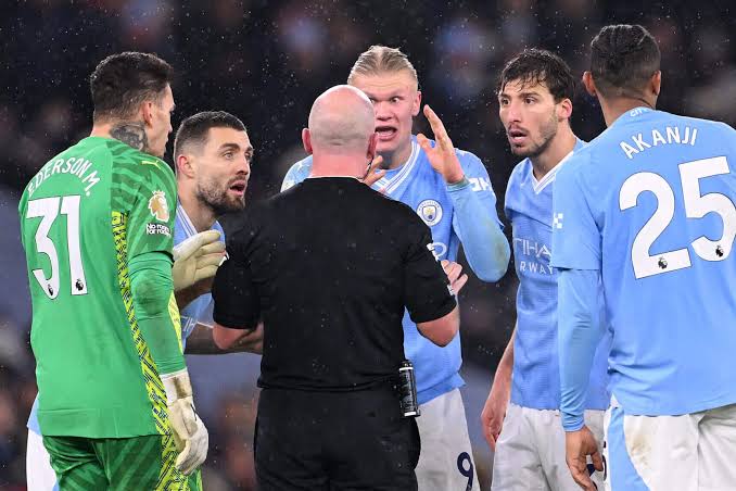 Manchester City players laying complaints to match referee for a VAR call in last season fixture. Photo Credit- The New York Times