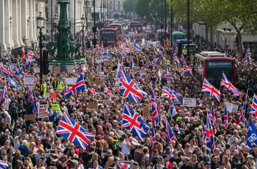 Crowds waving Union Jacks and St George’s Cross flags in central London