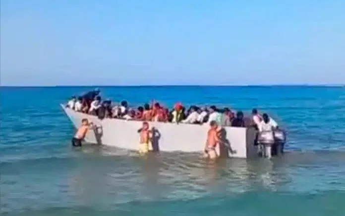  Migrant boat pushed back by sunbathers in Greece