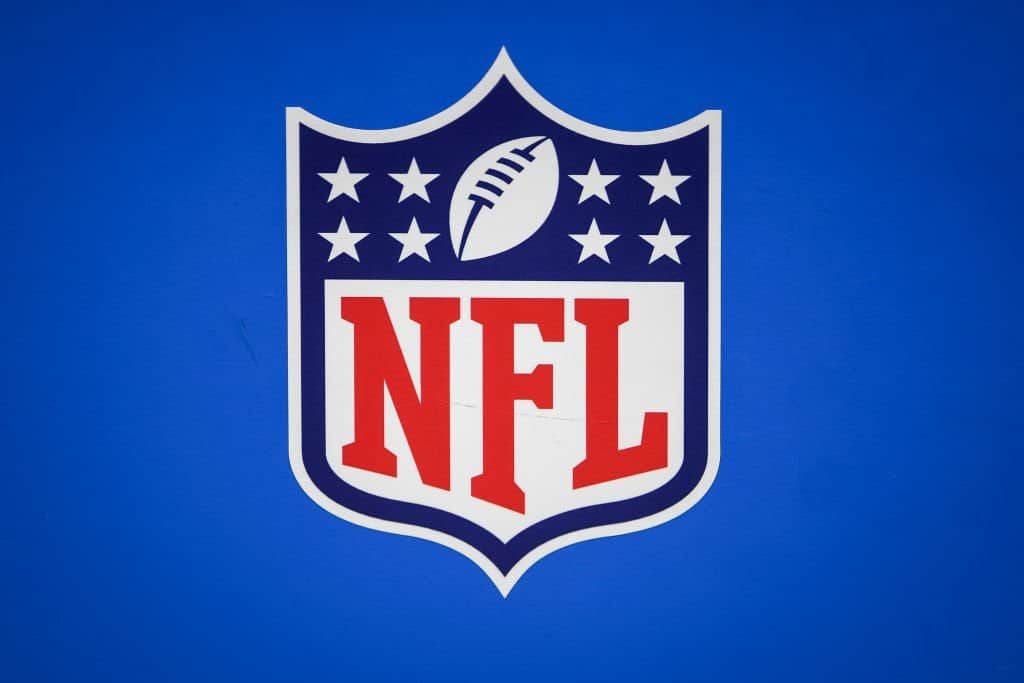 The NFL logo features eight stars representing the league’s divisions.
