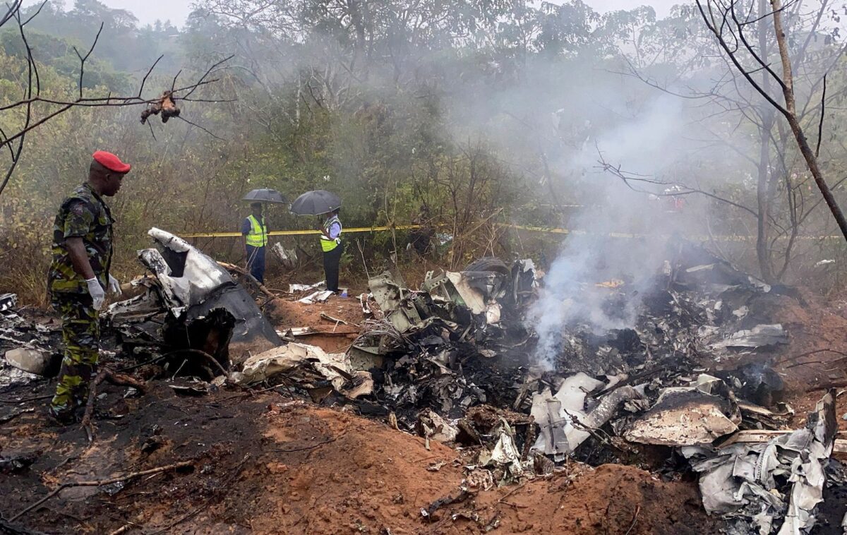 Security officials secure the wreckage of the aircraft 5Y-CCA operated by Mombasa Air Services, which crashed Tuesday on its way from Diani to Kichwa Tembo, in Kwale County, Kenya. Laban Walloga/Reuters