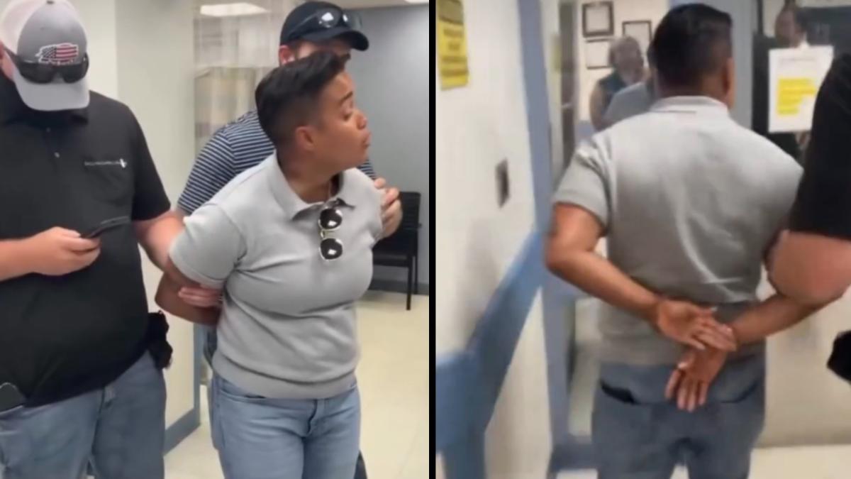 Alderperson Jessie Fuentes is put into handcuffs by ICE agents while asking about a warrant for a detained man on Oct. 3, 2025. Image Credit: 26th Ward Office