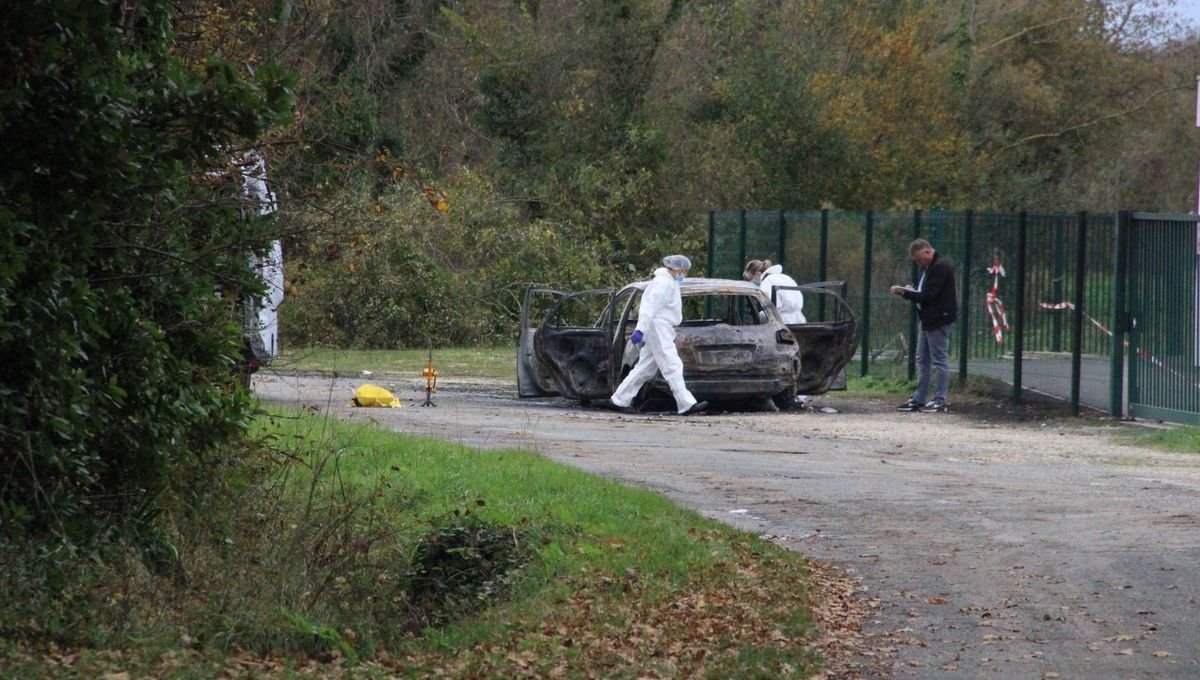 Police inspect the burnt car used in the Ile d’Oléron attack.
