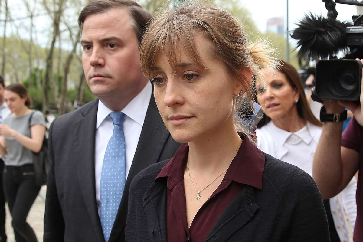 Actress Allison Mack (R) departs the United States Eastern District Court after a bail hearing. Credit : Jemal Countess/Getty Images