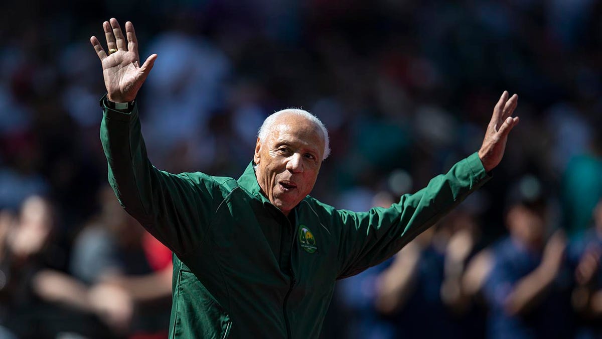 Lenny Wilkens, coach of the 1979 Seattle Supersonics basketball team, acknowledges the crowd before a game between, at T-Mobile Park on June 1, 2019 in Seattle, Washington, during ceremony celebrating the 40th anniversary of the team's championship. (Stephen Brashear/Getty Images)