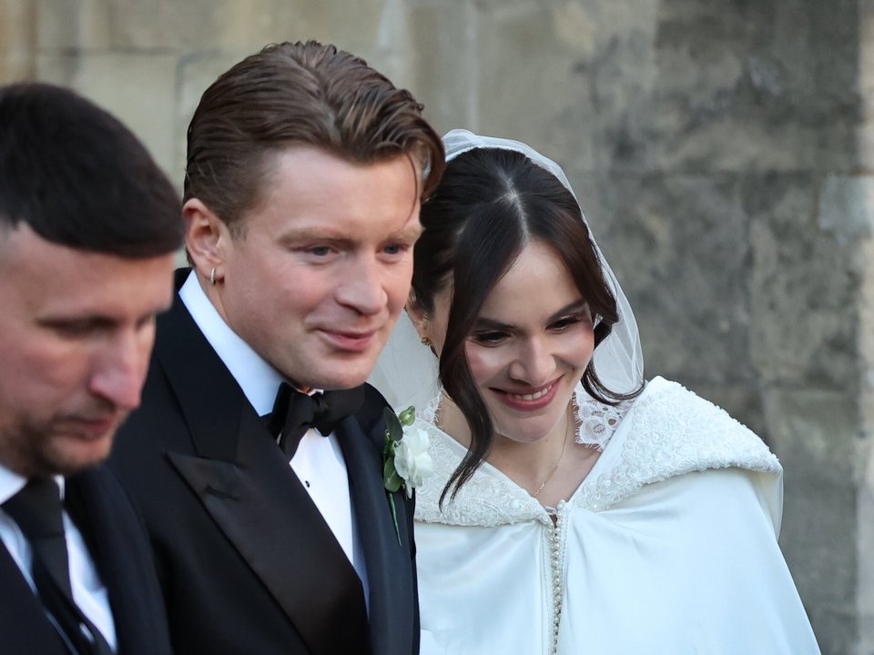 Newlyweds Adam and Holly Ramsay emerge from the churchCredit: i-Images