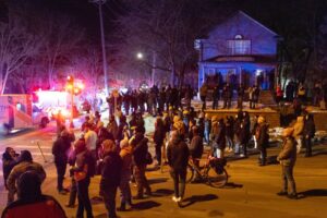 Residents clash with federal agents following a shooting incident on January 14, 2026 in Minneapolis, Minnesota. (Scott Olson/Getty Images) 