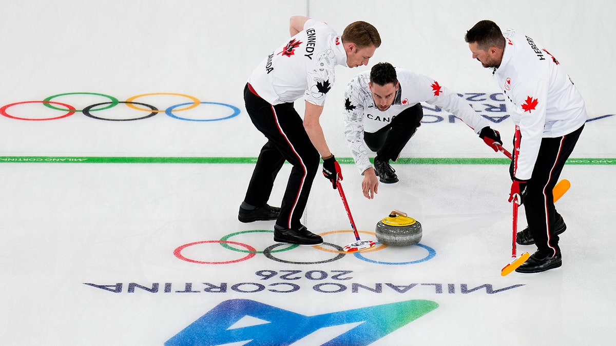 Canada's Ben Hebert, Brett Gallant and Marc Kennedy compete during a men's curling round-robin match against Switzerland at the 2026 Winter Olympics in Cortina d'Ampezzo, Italy, Feb. 14, 2026. (AP Photo/David J. Phillip) Cheating