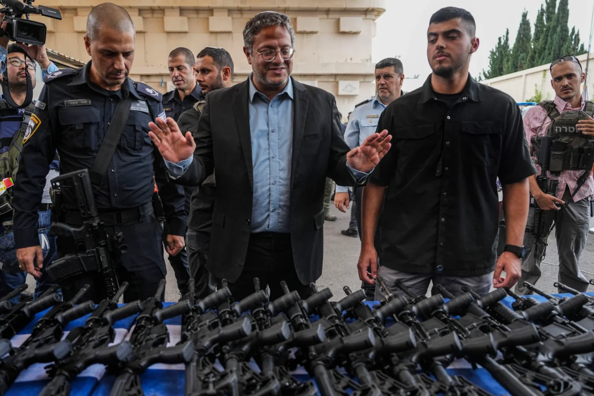 National Security Minister Itamar Ben-Gvir attends an event to deliver weapons to local volunteer security group members in Ashkelon, October 27, 2023. (AP/Tsafrir Abayov)