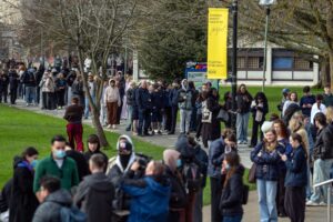 Students queue for antibiotics at the University of Kent as two people die from meningitis in the area