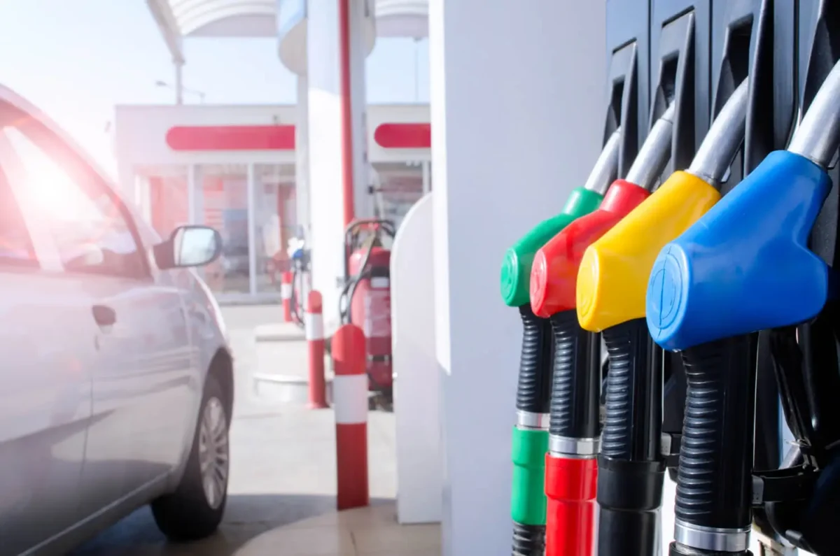 Drivers fill up at a gas station as rising gas prices push fuel costs higher.