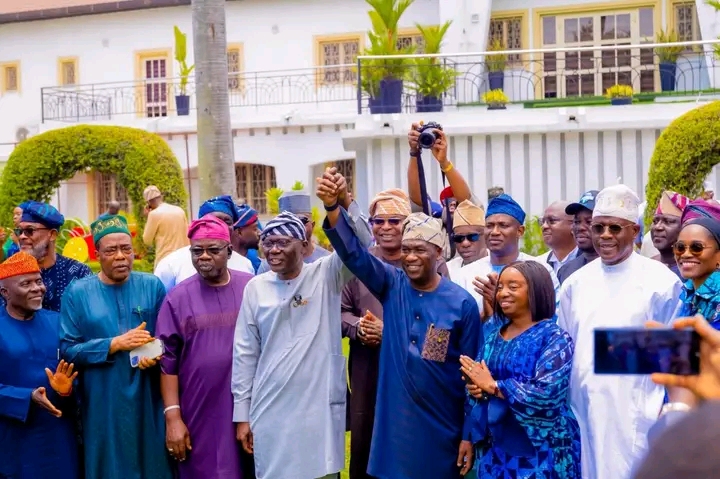 Sanwo-Olu raises Obafemi Hamzat hand at Lagos endorsement event. Image Credit: TheCable/Facebook 