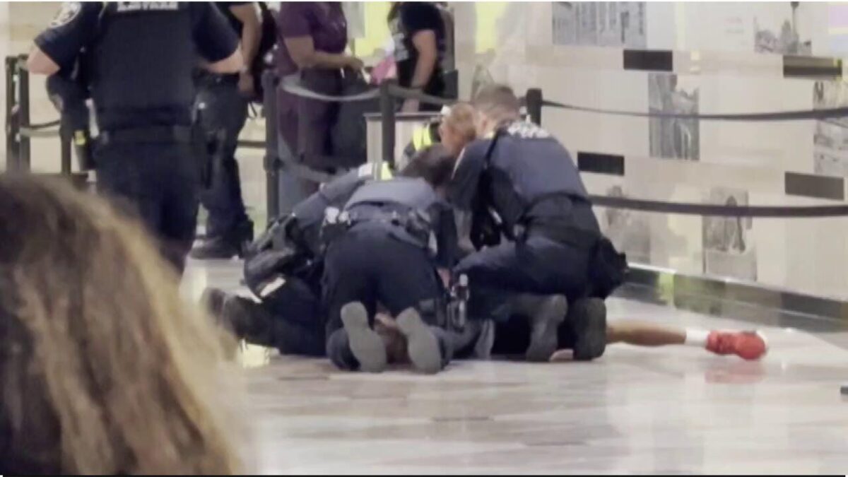 Amtrak police officers tackle and arrest a suspect believed to have stabbed six people inside Penn Station in New York City on June 7, 2026. CBS News New York