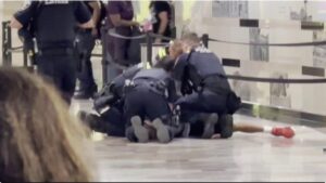 Amtrak police officers tackle and arrest a suspect believed to have stabbed six people inside Penn Station in New York City on June 7, 2026. CBS News New York
