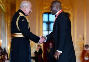 Idris Elba getting knighted by King Charles III 