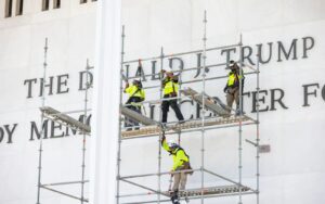 Workers remove Trump’s name from Kennedy Center facade. Image Credit: EPA Images Pic