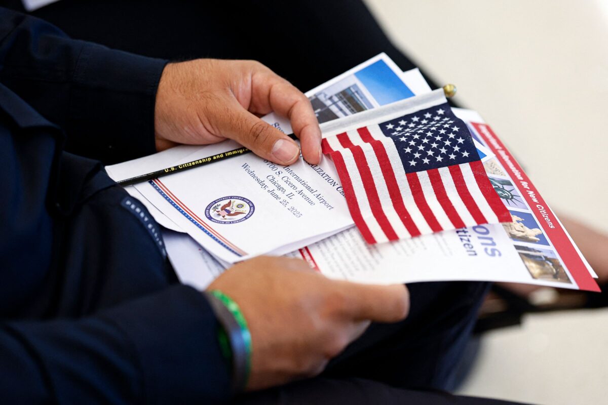 Naturalized U.S. citizens face increased scrutiny under new DOJ denaturalization efforts. Image Credit: Kamil Krzaczynski/AFP/Getty Images