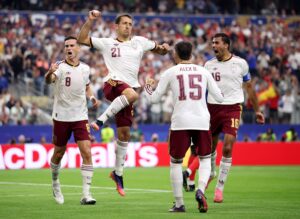 Mikel Oyarzabal of Spain celebrates with teammates after converting a penalty to score the team's first goal during the World Cup 2026 semifinal match against France. Hector Vivas / FIFA via Getty Images