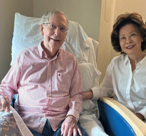 Mitch McConnell's office released this photo of the senator with his wife, Elaine Chao, and a copy of the day's Washington Post newspaper. (Supplied: Office of Senator Mitch McConnell)