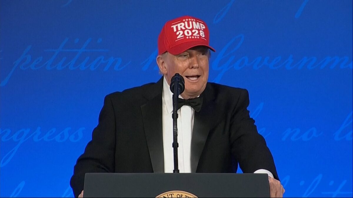 President Donald Trump wears a "Trump 2028" hat during the White House Correspondents' Dinner