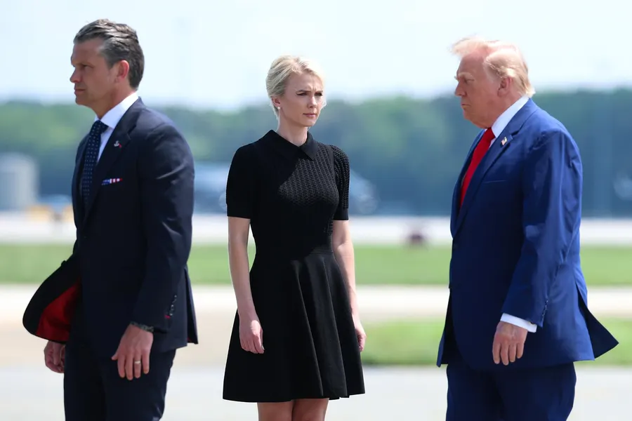 Secretary of War Pete Hegseth, executive assistant to U.S. President Donald Trump Natalie Harp, and U.S. President Donald Trump attend a dignified transfer at Dover Air Force Base on July 22, 2026 in Dover, Delaware. (Photo by Kevin Dietsch/Getty Images