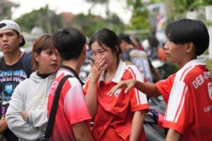 A schoolgirl cries outside her school where deaths and injuries were reported after a shooting in Thailand's Nonthaburi province, Friday, Aug. 7, 2026.Sakchai Lalit/AP