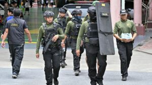 Armed police walk through the school premises after a shooting in Bang Kruai district, Nonthaburi province, north of Thailand's capital Bangkok, on August 7, 2026. Image Credit: Suwanrumpha/AFP via Getty Images