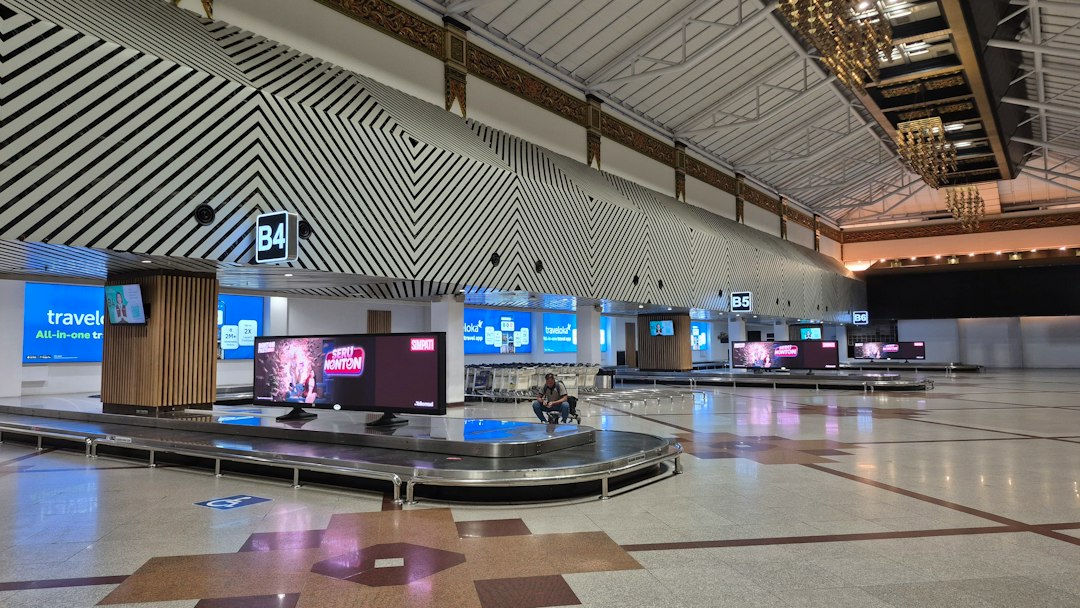 Airport baggage claim area showing luggage conveyor belts; illustrative image, not from the Nigerian training.