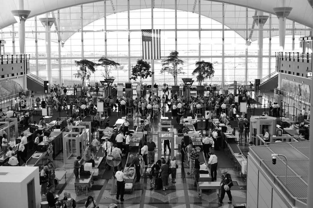 Airport security checkpoint with passengers moving through screening lanes; illustrative image, not from the Nigerian training.