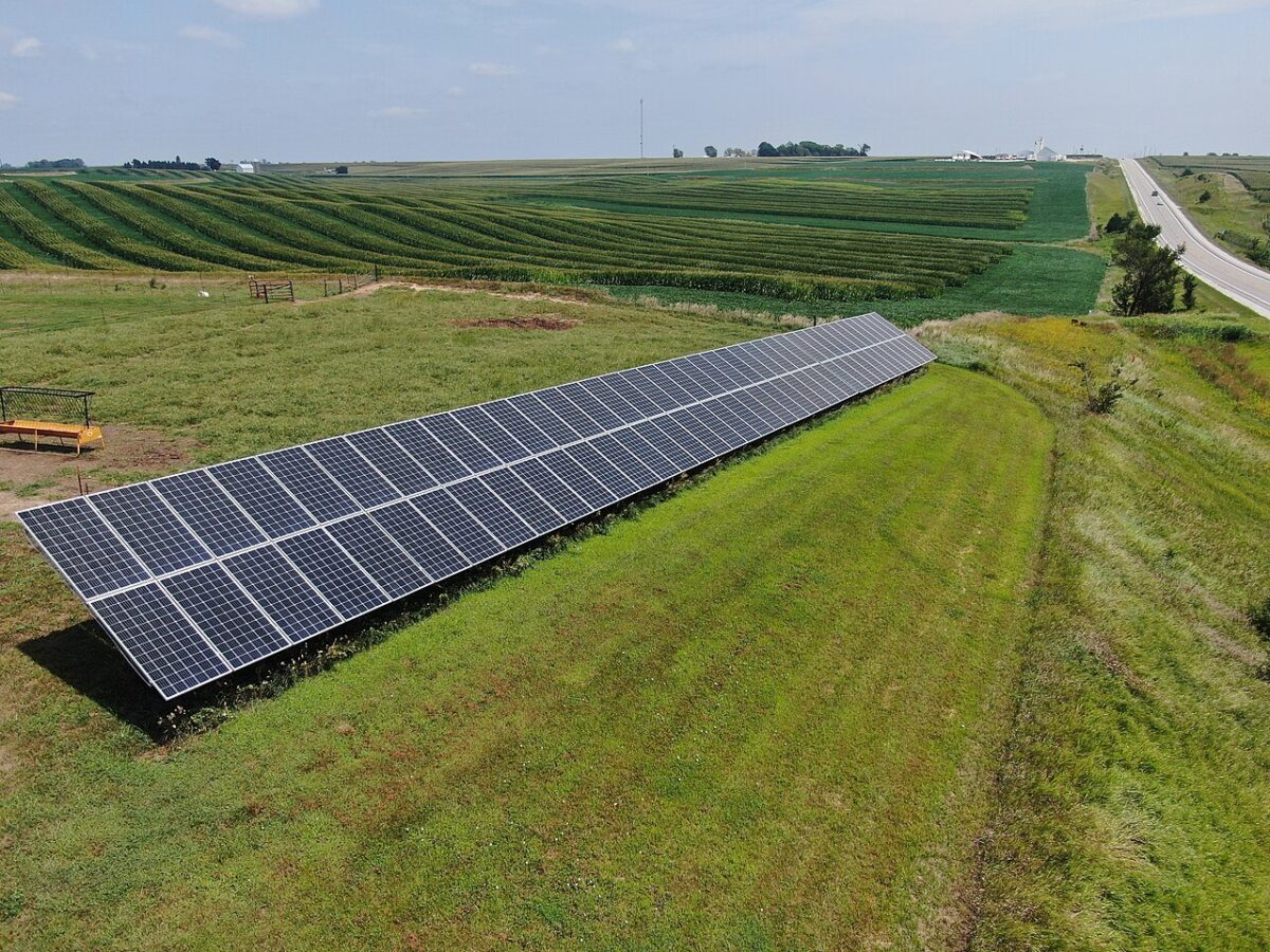 Aerial view of rows of photovoltaic solar panels on a US farm.